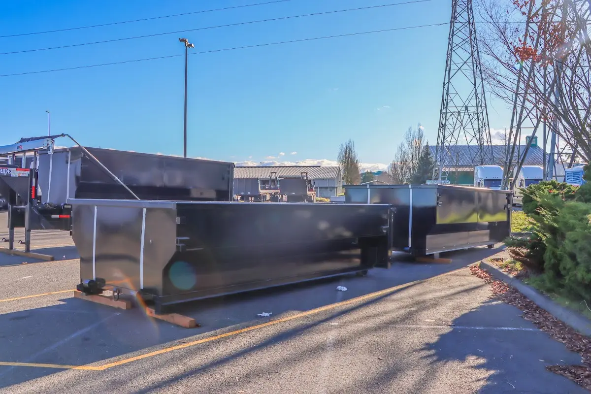 Roll-off dumpster ready for waste disposal at job site for Concrete Dumpster Rental in Willington